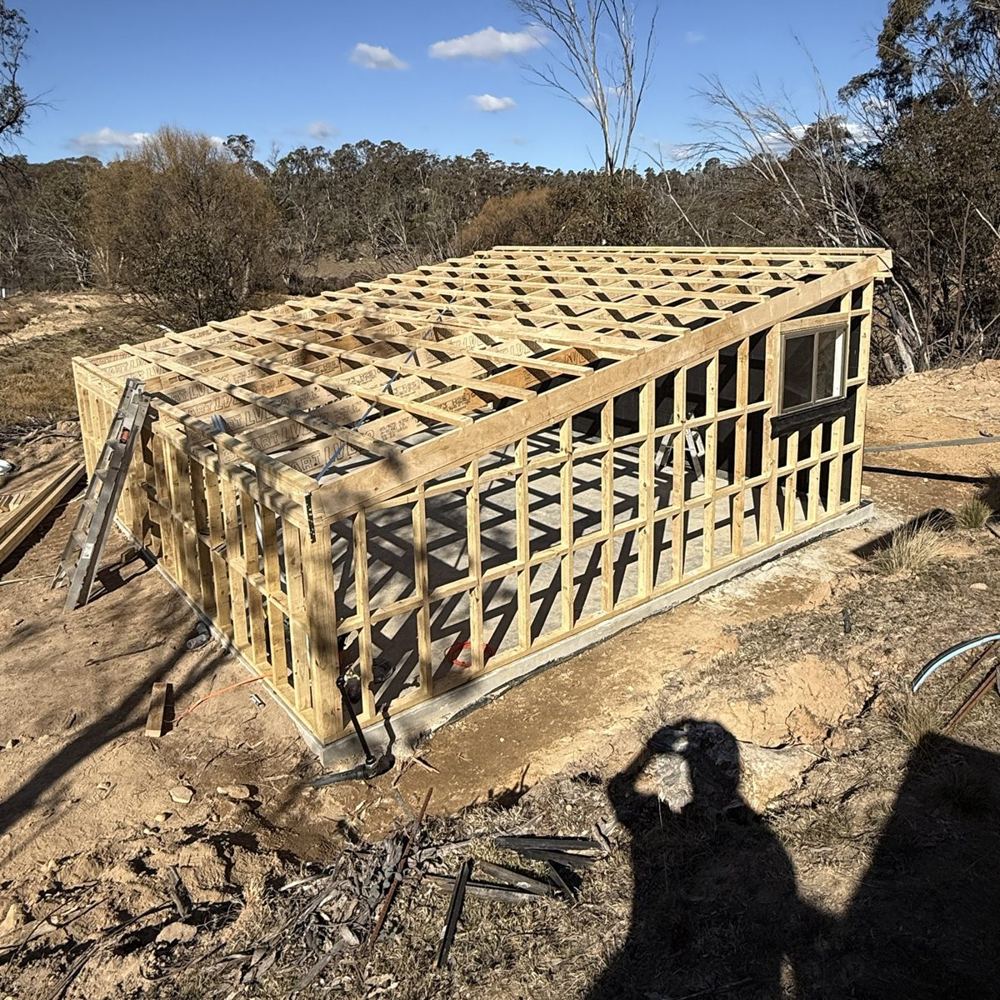Timber wall and roof framing on a new build in bushland